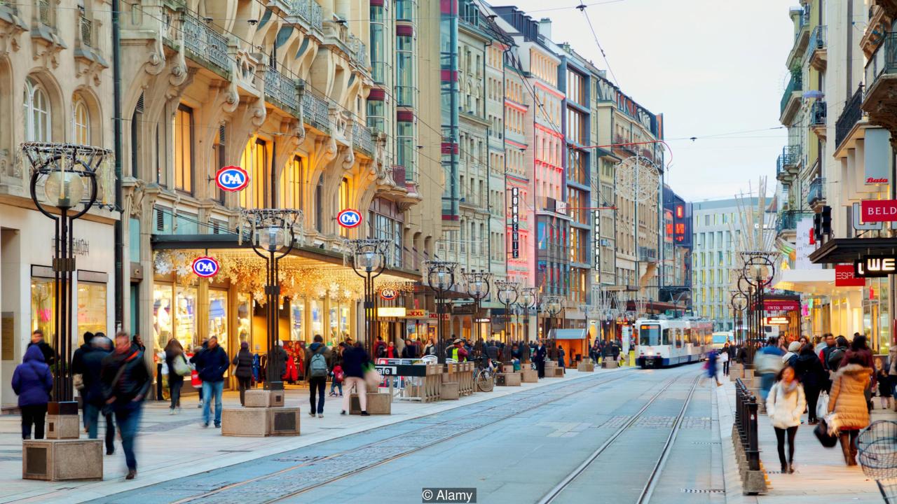 GENEVA, SWITZERLAND – NOVEMBER 27: Rue du Rhone with people on November 27, 2015 in Geneva, Switzerland.